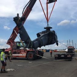 Black Hawk Helicopter being loaded onto a truck