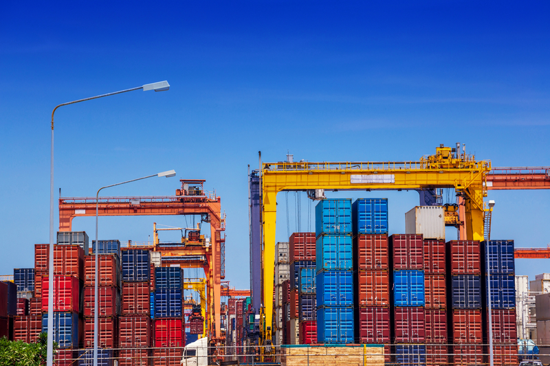 Container cargo freight ship in container terminal yard in sea port.
