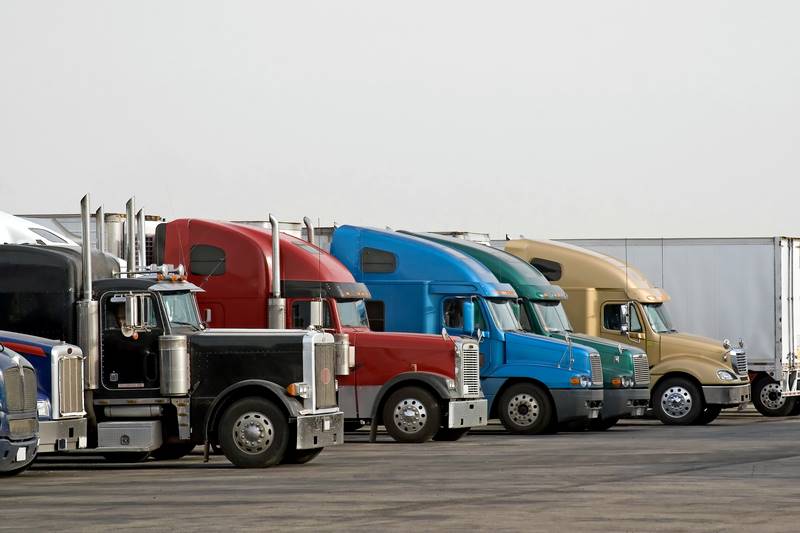 Semi-trucks parked at a truck stop